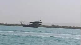 نمای هوایی از سواحل فیروزه‌ای جزیره هنگام